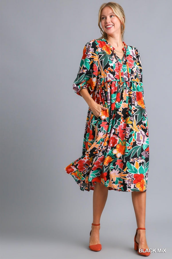 Umgee Floral Print V- Notch Peasant Dress with 3/4 Puff Sleeves, Neck Tie Detail, Side Pockets and Ruffle Trim Along Neckline No Lining