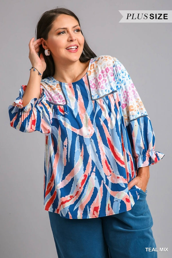 Umgee Mixed Print Top with 3/4 Sleeves and Lace Trim. Features Open Split Back Details with Button Closure