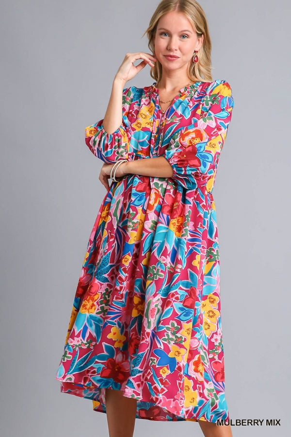 Umgee Floral Print V- Notch Peasant Dress with 3/4 Puff Sleeves, Neck Tie Detail, Side Pockets and Ruffle Trim Along Neckline No Lining